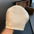 Detail view of the 100% pure wool knitted beanie hat, warm and cozy for autumn and winter wear. - 54-60cm / Beige