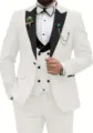Detailed view of white three-piece suit jacket, black peak lapel and double-breasted vest. - Ivory