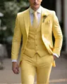 Men's bright yellow three-piece suit set featuring a classic blazer vest and trousers. - Yellow