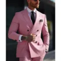 Men pink double breasted suit close-up detail showcasing tailoring and textured lapel design - Pink