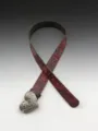 Western vintage heart embossed leather belt detail view showcasing intricate floral pattern. - 102cm / Red