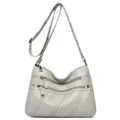 Dames zachte lederen schoudertas casual crossbody tas met meerdere ritsvakken grijs. - Lichtgrijs