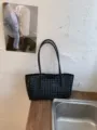 Black woven leather shoulder bag, chic hollow-out tote design, spacious underarm commuter bag. - No Pendant / Black