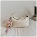 White woven leather shoulder bag with chic metal lock and cute plush dog bow keychain. - With Pendant / Off White