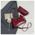 Wine red PU leather shoulder bag set with stylish cute charm for daily commute and style - Red with Pendant