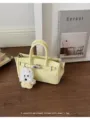 Yellow litchi pattern leather handbag with cute dog pendant, vintage Kelly style design. - With Pendant / Yellow