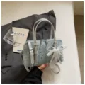 Fashion denim bowling shoulder bag with pearl bow and chic rivets for women casual daily use. - Silver With Pendant