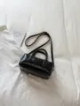 Stylish black patent leather cylinder handbag, chic minimalist small shoulder bag for daily wear. - No Pendant / Black