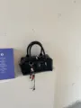 Black fashion handbag stylish shoulder bag with bead charm and metal zipper closure. - With Pendant / Black