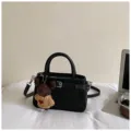 Black PU leather handbag for women, stylish crossbody tote bag with cute bear pendant and strap. - With Pendant / Black