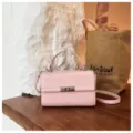 Pink PU leather crossbody bag for women, stylish vintage square shoulder bag with metal lock. - Pink