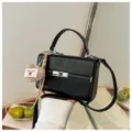 Black retro structured top handle bag with cross-body strap and cute knit heart charm. - With Pendant / Black