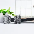 Men's classic black and white houndstooth pattern bow tie with adjustable elastic strap. - Small Black and White Houndstooth (ZZLJ14)