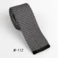 Men's black knitted flat-end tie, classic business and casual polyester necktie style. - Classic Black