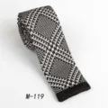 Stylish men's black and white knit tie, flat-end design, perfect for casual or formal wear. - Black & White Woven