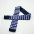 Men's knitted flat-end necktie in blue and white geometric diamond pattern for business. - Blue White Black Diamond