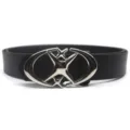 Detailed view of the black leather belt with silver star moon buckle, showcasing stylish design. - Black