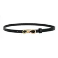 Detailed view of women's thin black leather belt featuring a chic gold knot buckle. - Black