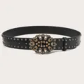 Vintage rhinestone black leather belt featuring metal studs and ornate carved metal buckle. - Black