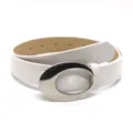 Close-up detail shot of a white leather belt featuring a sleek shiny oval metal buckle. - Bright White / Length 105cm Width 2.8cm
