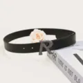 Detailed view of women's black PU leather belt featuring stylish metallic R buckle. - Length 105cm Width 2.8cm / Black