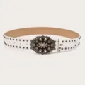 Stylish white leather decorative belt featuring a vintage rhinestone carved buckle and rivets. - White