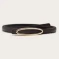 Detail view of a slim dark brown leather belt featuring a sleek gold-colored oval buckle. - Width 1.3cm, Length 105cm / Coffee