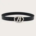 Trendy Y2K style black leather belt with unique silver letter buckle, perfect for jeans. - Black