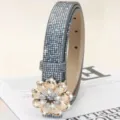 Detailed shot of a dazzling rhinestone flower buckle belt with sparkling crystals and PU leather. - Silver Gray / Length 105cm Width 2.3cm