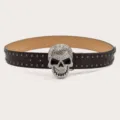 Detailed close-up of a punk style leather belt with a sparkling rhinestone skull buckle and studs. - Length 105cm Width 3.8cm / Coffee