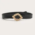 Zwarte lederen riem met gouden strass geometrische gesp, elegante vrouwenaccessoire. - Zwart