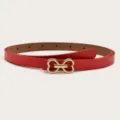 Close-up detail of a stylish red leather belt featuring a cute gold double heart buckle design. - Red