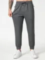 Herren Freizeit Jogginghose Detailansicht, dunkle graue Sweatpants mit Kordelzug. - XS / Bein mit Bündchen / Grau