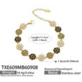 Edelstahl vergoldetes Blumenarmband mit schwarzen und weißen Zirkoniasteinen, 17+5 cm lang. - Armband / 17+5cm / Schwarz