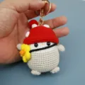 Porte-clés pingouin au crochet fait main avec chapeau champignon rouge, charmant pendentif sac. - Pingouin Champignon