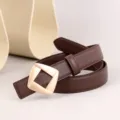 Women's brown leather belt detail view featuring a chic golden geometric metal buckle. - 100cm / Coffee