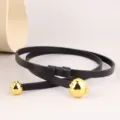 Close-up detail of black leather thin belt featuring elegant gold metal sphere ends. - 100cm / Black