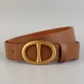 Brown leather belt featuring a stylish golden oval buckle for daily wear and jeans. - Brown