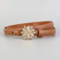 Detailed view of brown leather women belt with sparkly rhinestone buckle for jeans and dresses. - 100cm / Brown