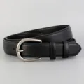 Detailed view of women's genuine leather belt, classic black design with silver buckle. - 100cm / Black
