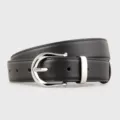 Minimalist black leather belt detail for women featuring a sleek silver metal buckle. - 100cm / Black