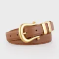 Close-up detail of brown leather women belt with unique gold horseshoe buckle and dual loops. - Brown