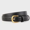 Close-up view of the black leather belt featuring a matte gold metal buckle and neat stitching details. - 100cm / Black