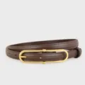 Close-up detail of a women's brown leather belt with a sleek gold-tone oval metal buckle. - 100cm / Coffee