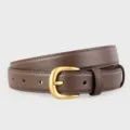 Detailed close-up of brown genuine leather women's belt featuring a classic gold metal buckle. - 100cm / Coffee