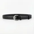 Detailed view of women black leather belt with stylish silver twisted metal buckle accessory. - Black