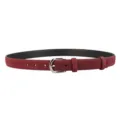 Detailed close-up shot of a stylish burgundy suede belt featuring a polished silver metal buckle. - Angola Red