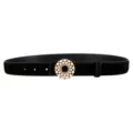Black suede belt detail featuring a sparkling pearl rhinestone round buckle accessory. - Black