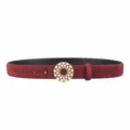 Close-up of women red suede leather belt with elegant pearl rhinestone round buckle detail. - Angola Red