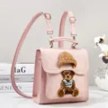 Cute pink PU leather mini backpack featuring 3D knitted bear patch and versatile strap design. - Pink
